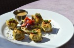 Z'Tejas' chorizo dumplings are served on the Arboretum location's porch. (Iain Oldman/Community Impact Newspaper)