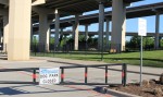 A park with a closed sign on the gate