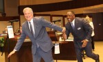 Former Mayor Harry LaRosiliere (right) hands off the gavel to new Mayor John Muns at the May 10 City Council meeting. (Erick Pirayesh/Community Impact Newspaper)