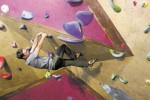 Photo of a man climbing on a rock wall