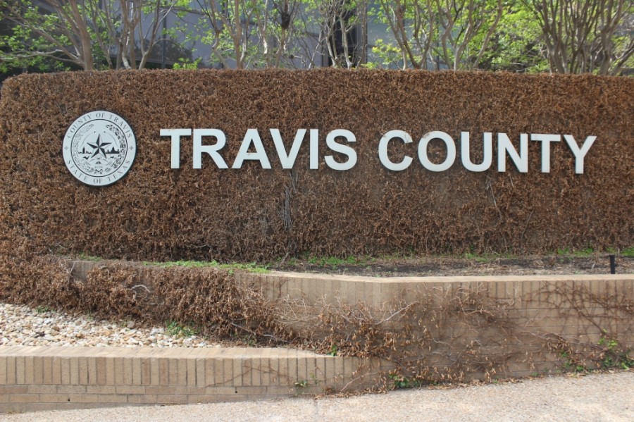 Photo of a Travis County sign
