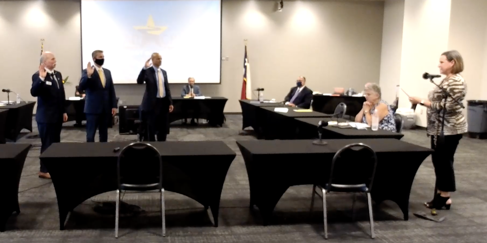 From left, Larson, Cottrell and Cunningham were sworn in as board members during the May 24 meeting. Cunningham kept his seat in District 5 after a recount of the votes from that race. (Courtesy of Clear Creek ISD)