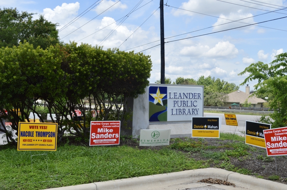 Signs outside Leander Public Library