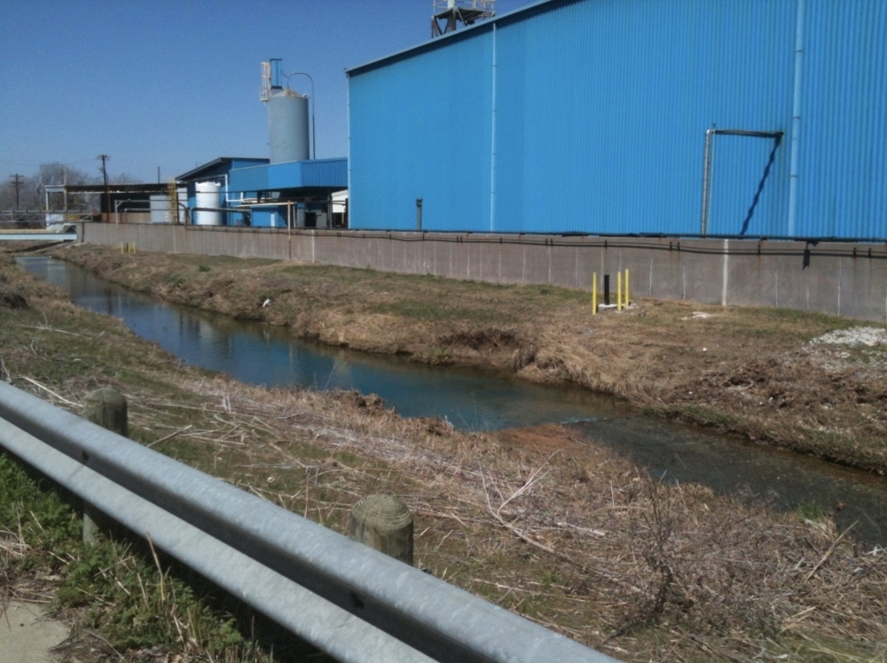 Exide Technologies’ battery recycling plant operations were located right next to Stewart Creek, as seen in this 2013 photo. All of the buildings at the site have since been taken down, but contamination of the site remains. (Courtesy Exide Technologies)