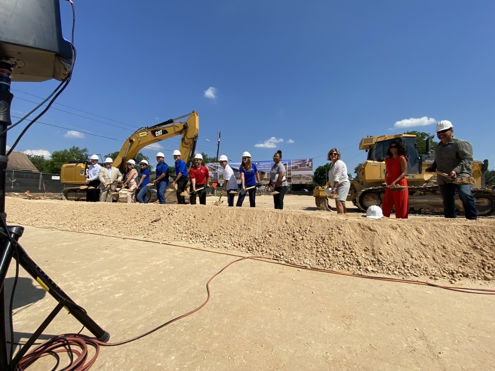 Members of the Johnson family joined Council members and city employees in the groundbreaking ceremony. (Brooke Sjoberg/Community Impact Newspaper)