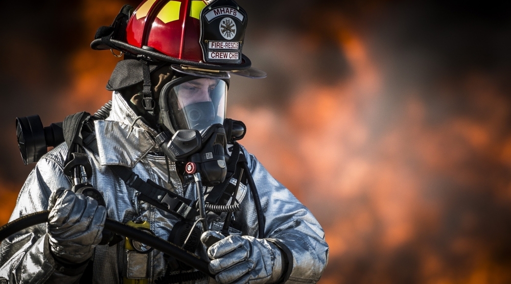 person in fire fighting suit