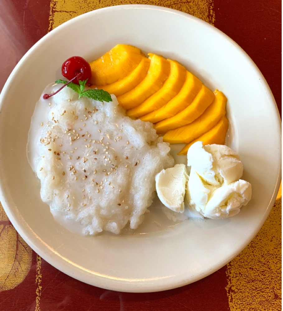 Popular desserts are mango or coconut ice cream with sticky rice. (Ellie Borst/Community Impact Newspaper)