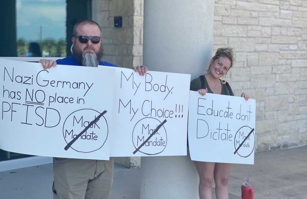 People protesting a mask mandate from PfISD showed up to the district's administration building ahead of the school board's special meeting Aug. 16. (Brian Rash/Community Impact Newspaper)