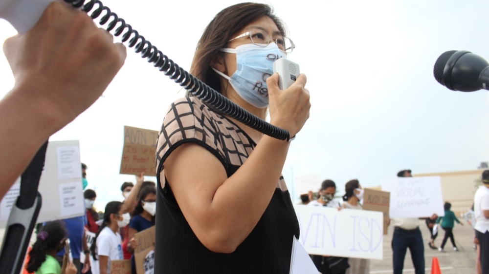 Helen Shih, a scientist and Pearland ISD parent, spoke in favor of a district mask mandate during a rally outside of Pearland ISD's board of trustees meeting on Aug. 16. (Andy Yanez/Community Impact Newspaper)