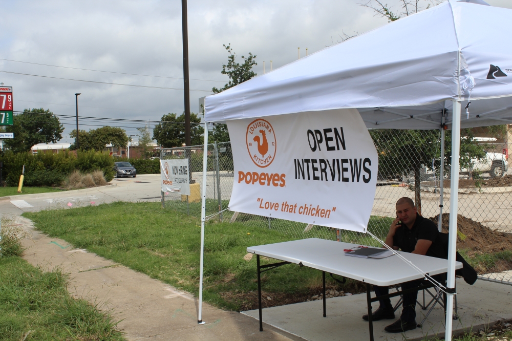 Popeyes regional manager Ty Ashcraft holds open interviews at the future site of a Popeyes in Plano on July 23. (Erick Pirayesh/Community Impact Newspaper)