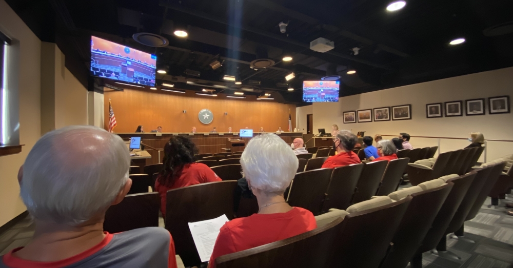 Members of Round Rock Preservation were in the audience of the Aug. 26 City Council meeting, wearing red T-shirts. (Brooke Sjoberg/Community Impact Newspaper)