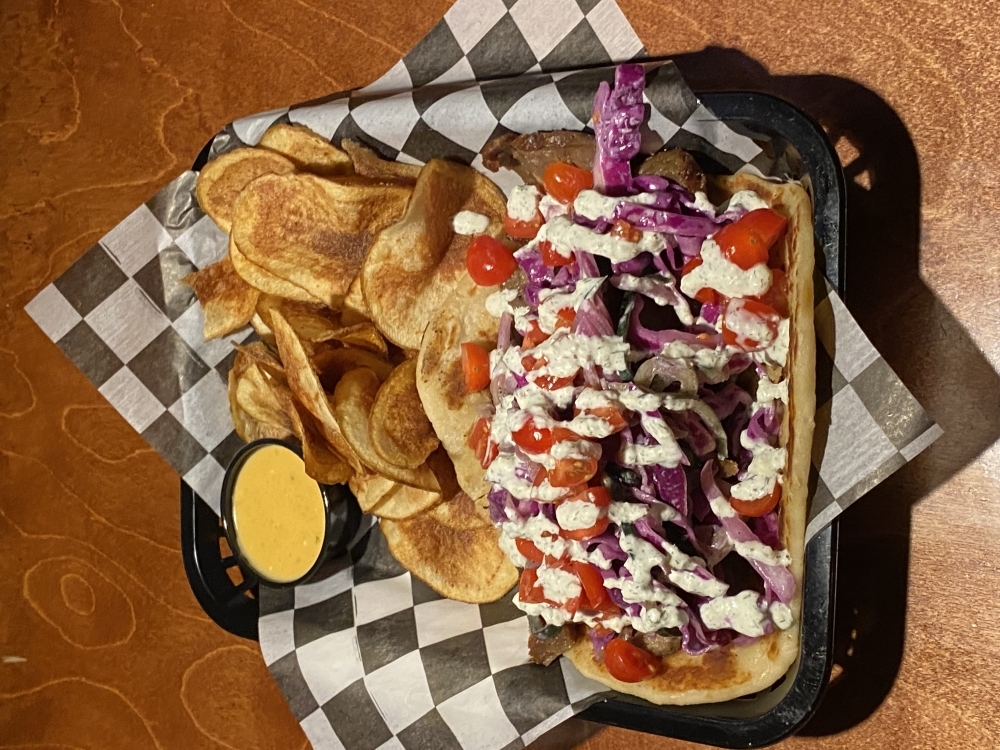 The doner kebab comes with house-made potato chips and beer cheese.