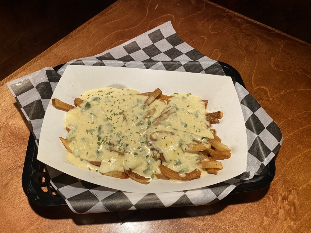 The poutine ($10) is topped with Texas or jager gravy and white cheese curds. (Photos Eric Weilbacher/Community Impact Newspaper)