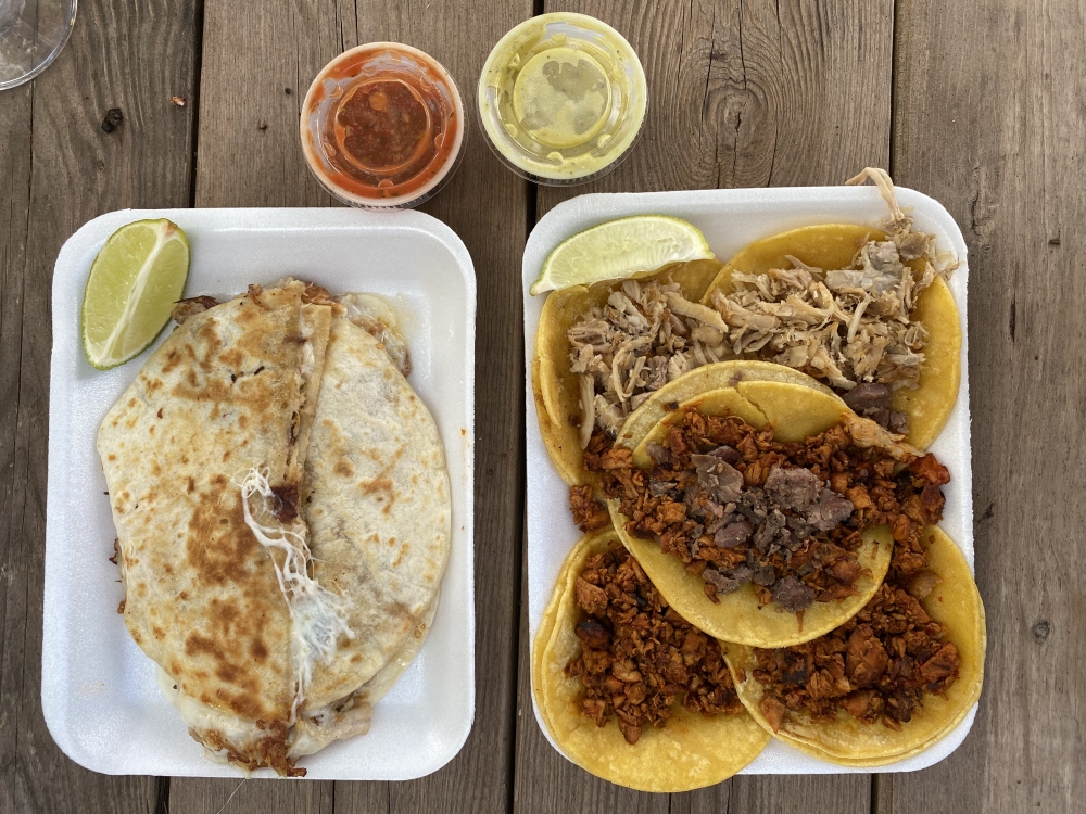 Campechano and pastor tacos, as well as a quesadilla from Dollar Taco. (Eric Weilbacher/Community Impact Newspaper)