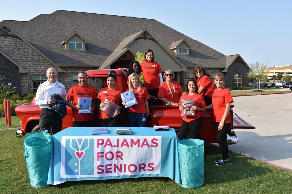 Godwin G. Dixon (far left), co-founder of Teresa's House, an assisted living and memory care home in McKinney, poses with Pajamas for Seniors staff and volunteers. The nonprofit hosted its second annual Grandparents Day Drive at the facility, where they collected pajamas for low-income senior citizens. (Brooklynn Cooper/Community Impact Newspaper)