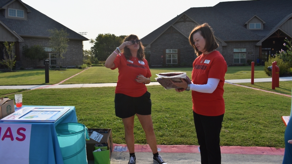 Jo Alch (right), founder and executive director of Pajamas for Seniors, and volunteer Allison Byrd-Haley collect pajama donations at Teresa's House in McKinney. (Brooklynn Cooper/Community Impact Newspaper)