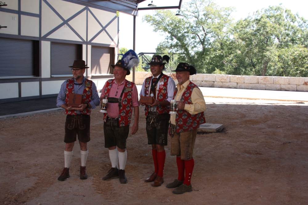 From left, Opas Dan Tharp, Grosse Opa Wayne Classen, Cesar Castilleja and Randy Rust show off examples of some of the bricks and where they will be placed.