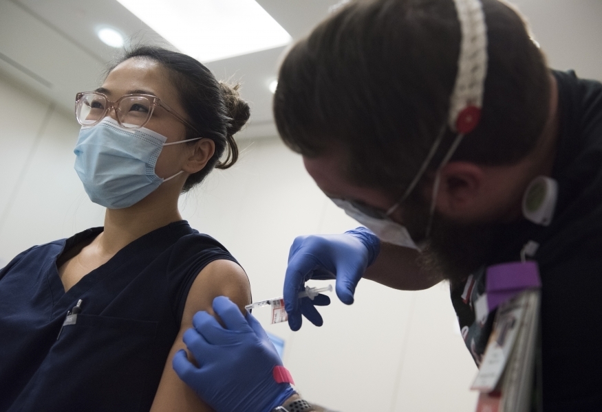 Photo of a woman receiving a vaccine