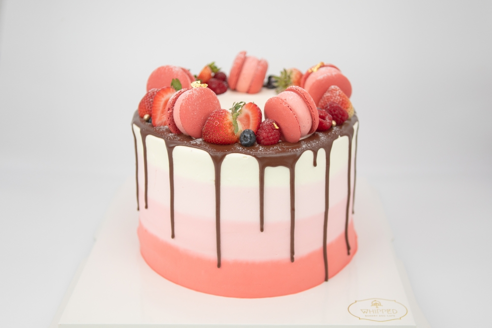 The cake pictured is a custom raspberry cake. Prices for customized cakes start at $75. (Courtesy Whipped Bakery & Cafe)