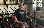 Owner Brian Morris sits on a P.K. Ripper, one of only 250 of its type ever made, at Freeride Bike Co. (Tom Blodgett/Community Impact Newspaper)