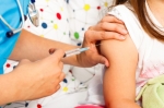 Photo of a child receiving a shot