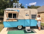 Lisa Franke stands with her trailer, Lucille, out of which she runs Lulu’s Pie Shoppe. (Brittany Andes/Community Impact Newspaper)