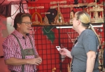 Kurt Schmidt talks to festival-goers about Schmidt Christmas Market at Oktoberfest on Oct. 17.