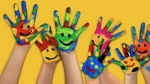 hands painted with smiley faces
