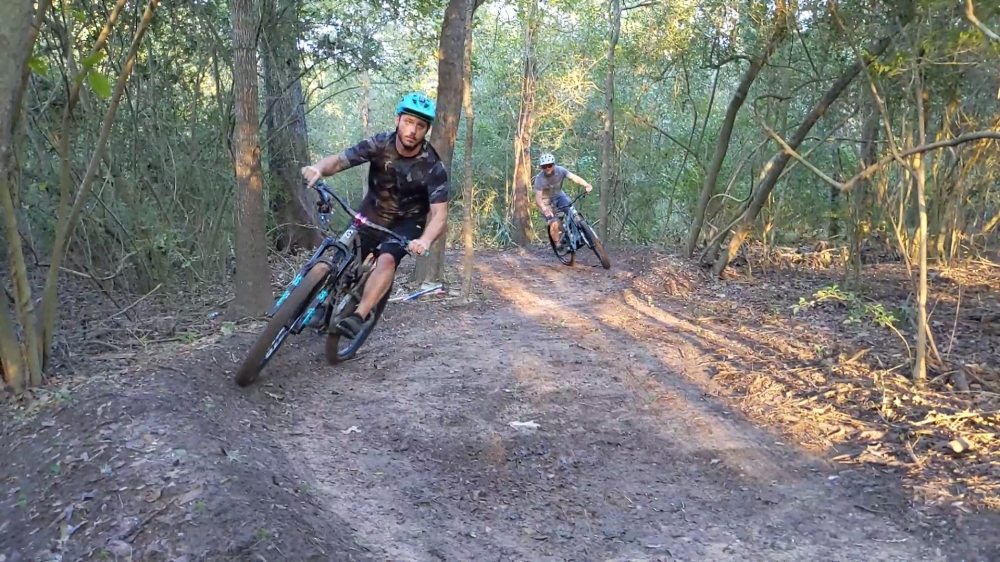 Mountain bikers and the city are working together to create a short course near Lynn Gripon Park at Countryside. Here, a couple of those bikers test out the course. (Jake Magee/Community Impact Newspaper)