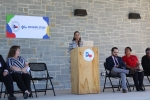 Heather Lagrone, Adrienne Holloway, Luis Guajardo, Maya Ford and Charleen Jones sit onstage while Holloway introduces the audience to the Harris County Housing Needs Assessment study on Oct. 19. (Emily Lincke/Community Impact Newspaper)