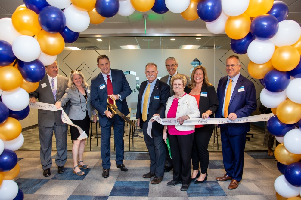 President and CEO George Hampton and Brentwood Mayor Rhea Little (center) facilitated a ribbon-cutting ceremony at Currax's new headquarters Sept. 29. (Courtesy Currax Pharmaceuticals)