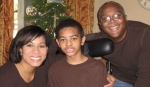 Juli Henderson and her husband, Chris, sit with their youngest child, Robert, who spent his 18 years of life fighting a rare mitochondrial disorder. Juli Henderson recently launched a blog, In Our Arms, to share her family's story and to inspire other parents with disabled children. (Courtesy Juli Henderson)