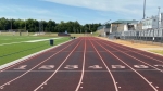 running track with worn sections