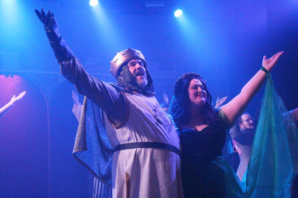 Stageworks Theatre actors Michael Raabe and Alaina Richard take a bow during a Sept. 30 dress rehearsal of “Monty Python’s Spamalot,” which runs Oct. 1-30. (Emily Lincke/Community Impact Newspaper)