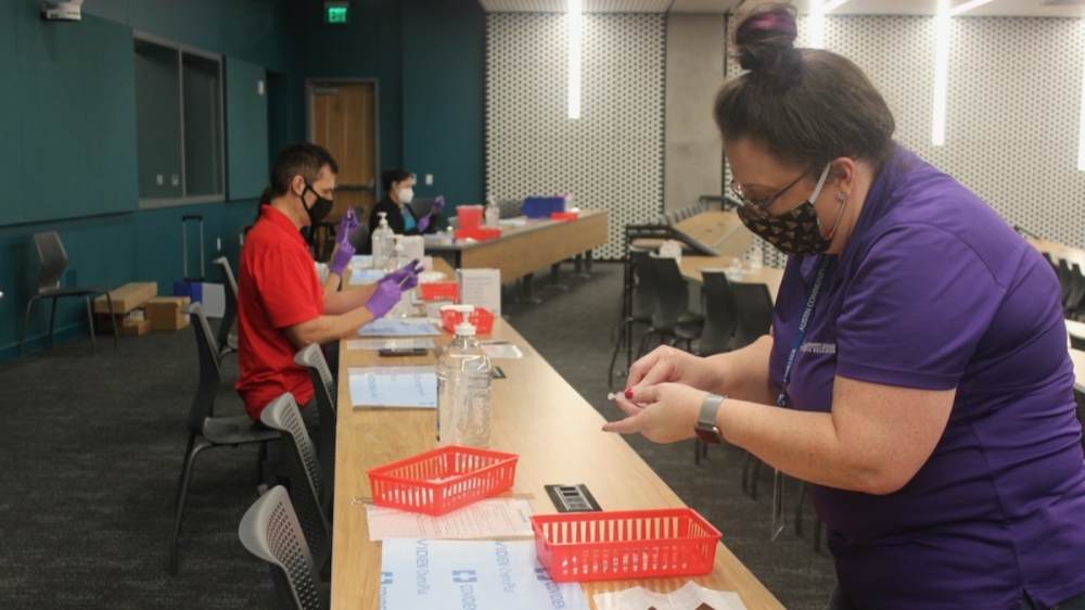 Photo of Austin Community College pharmacy students preparing vaccines