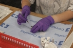 Giselle Copa, an Austin Community College pharmacy student, prepares a COVID-19 vaccine for administration. (Community Impact Newspaper staff)