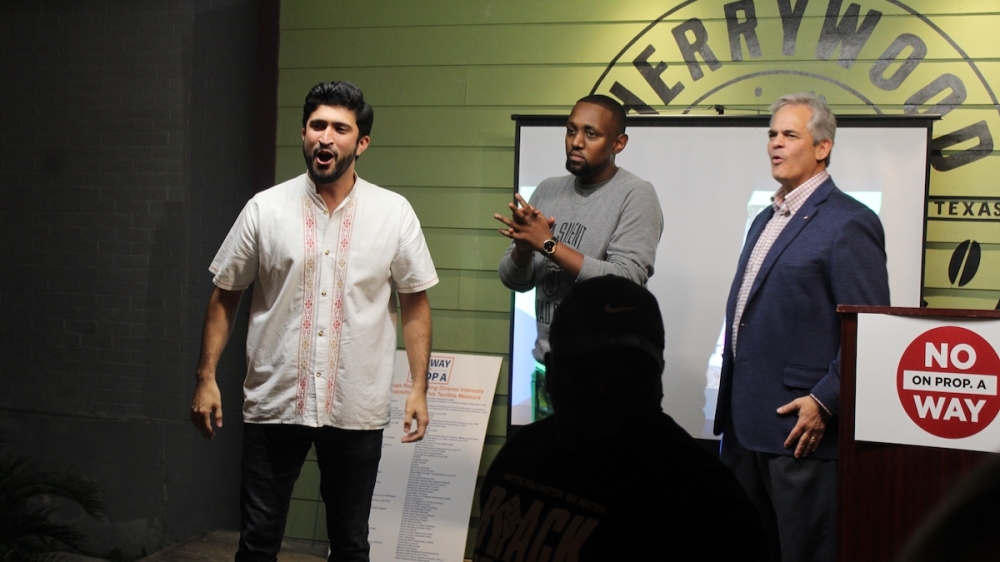 District 4 Council Member Greg Casar, left; Austin Justice Coalition executive directer Chas Moore, center; and Mayor Steve Adler participated in No Way on Prop A's Nov. 2 victory rally in East Austin. (Ben Thompson/Community Impact Newspaper)