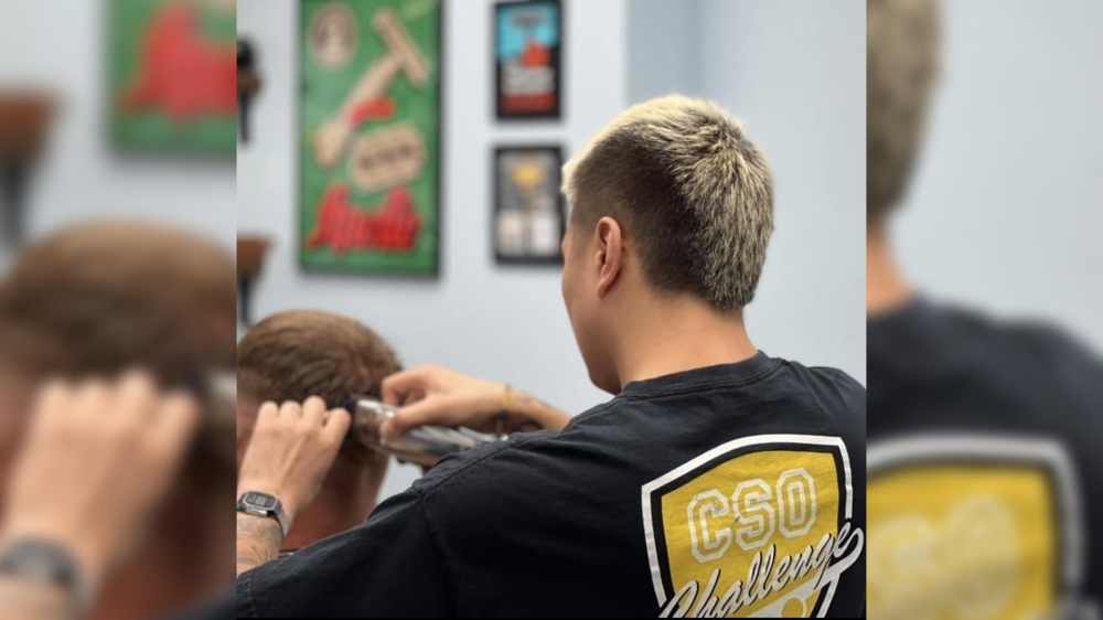 A man giving a haircut