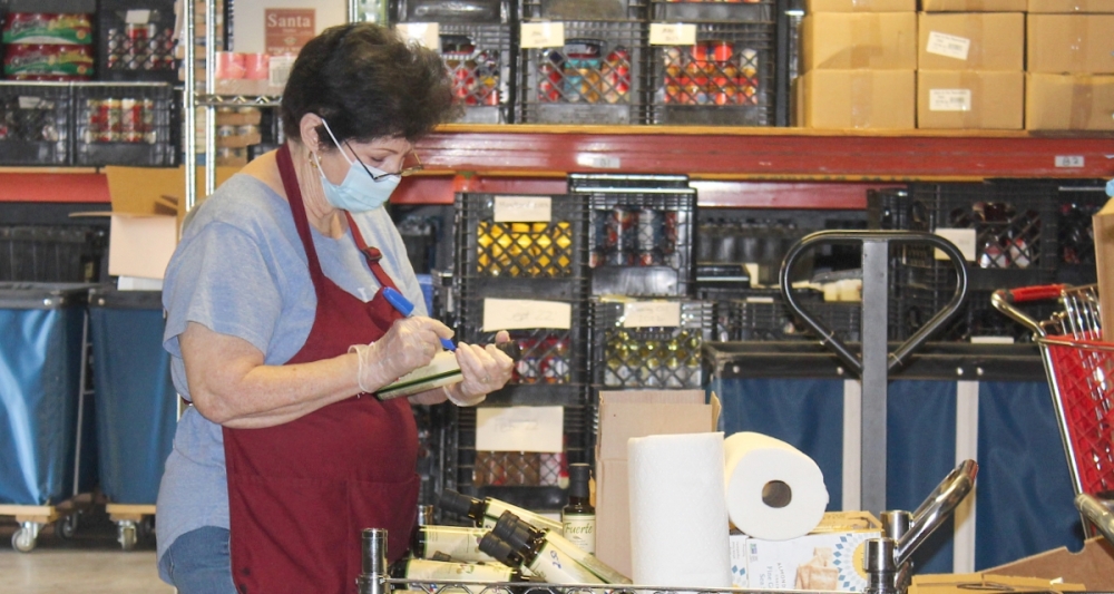 GRACE Grapevine’s pantry is run by volunteers who sort donations, stock shelves and help customers. Clients shop using a voucher system. (Bailey Lewis/Community Impact Newspaper)