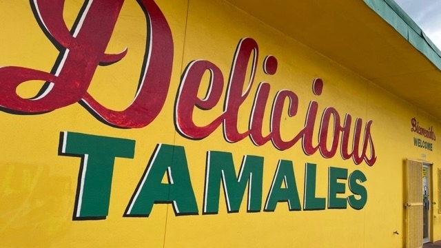 Photo of a mural with the words "Delicious Tamales"