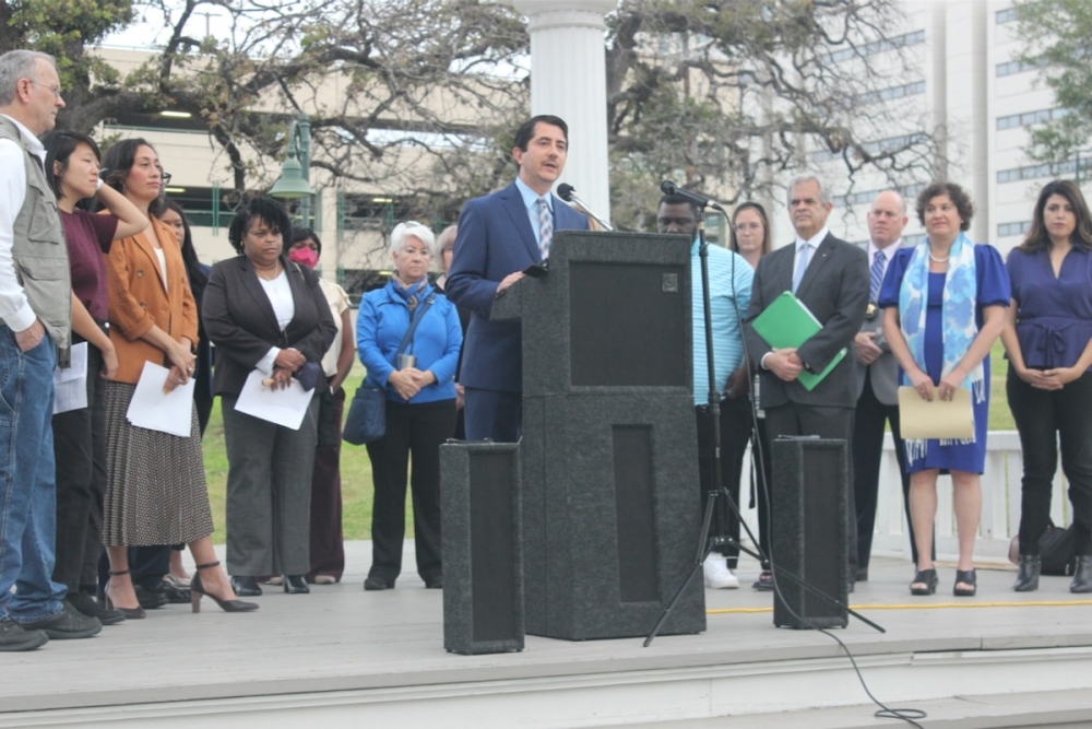 Photo of Jose Garza and other Austin-Travis County officials at a news conference