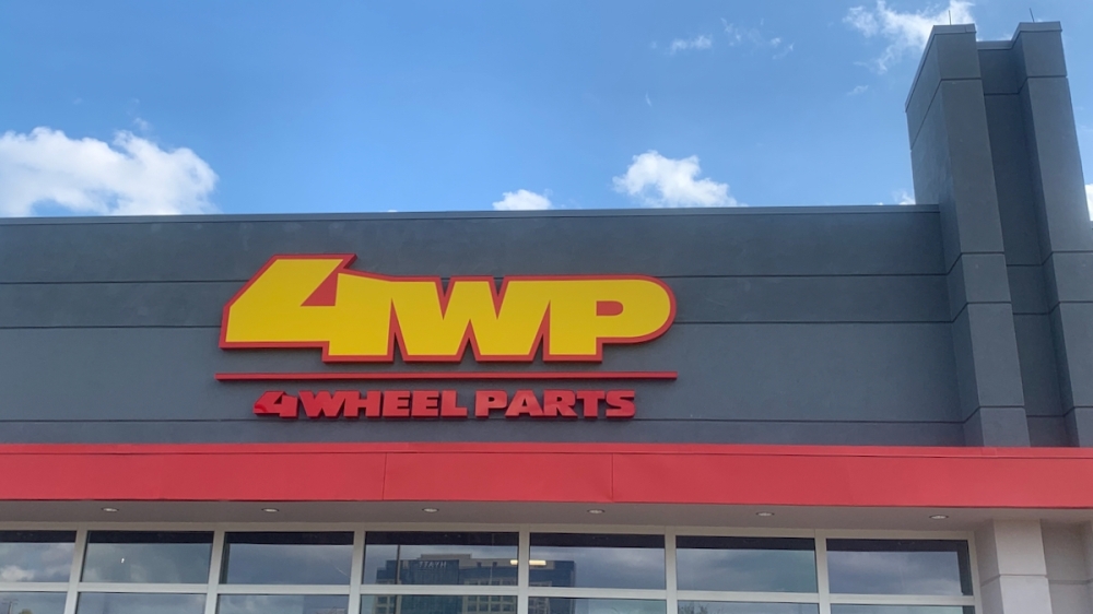 4 wheel parts store sign