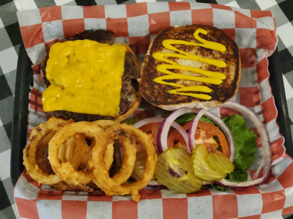 The Old Fashioned Burger ($7.99) comes with lettuce, tomato, onions, pickles and mustard. (Jarrett Whitener/ Community Impact)