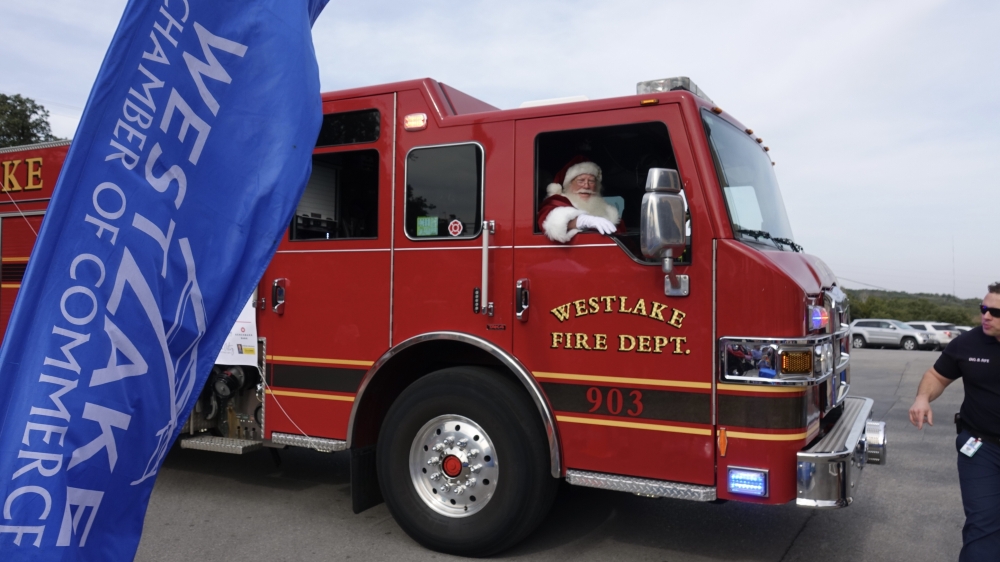 Santa Claus makes his entrance on the Westlake Hills fire truck. (Courtesy Westlake Chamber of Commerce)