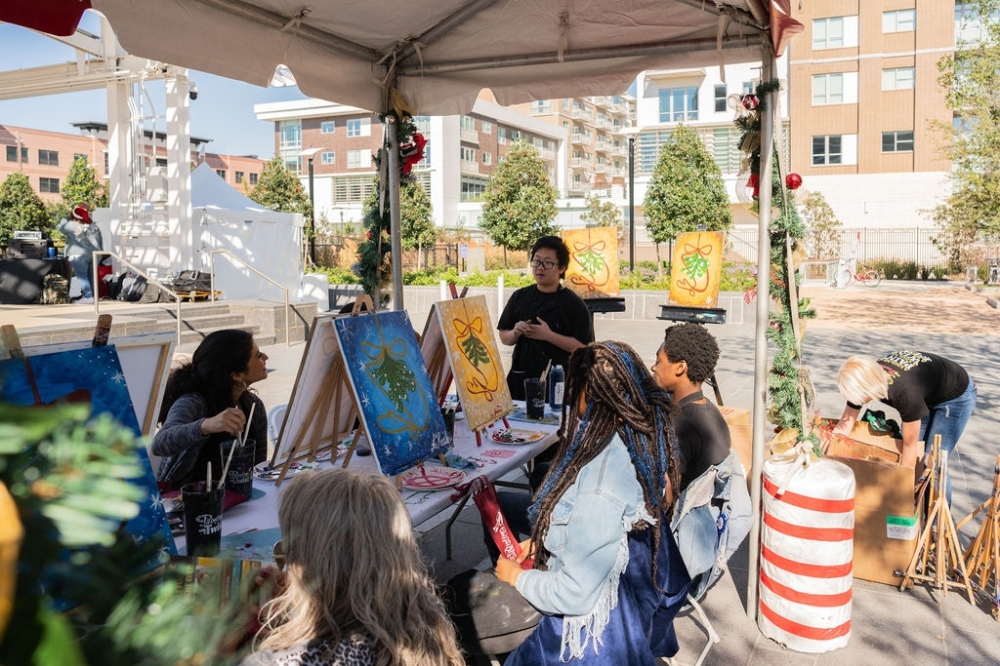 Guests take part in a painting class at a past Mistletoe Market. (Courtesy Midtown Houston)