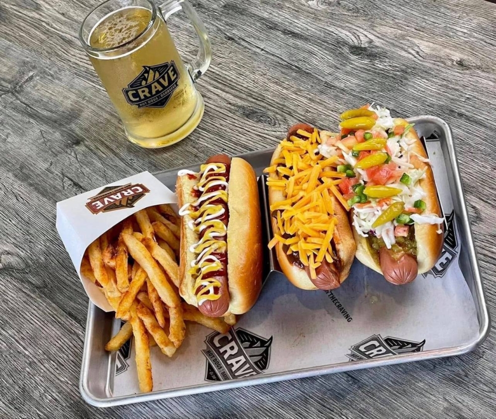 The eatery offers smoked brisket, pulled chicken and pulled pork along with 100% all-beef hot dogs, bratwurst, and hot and mild sausages. (Courtesy Crave Hot Dogs & BBQ)