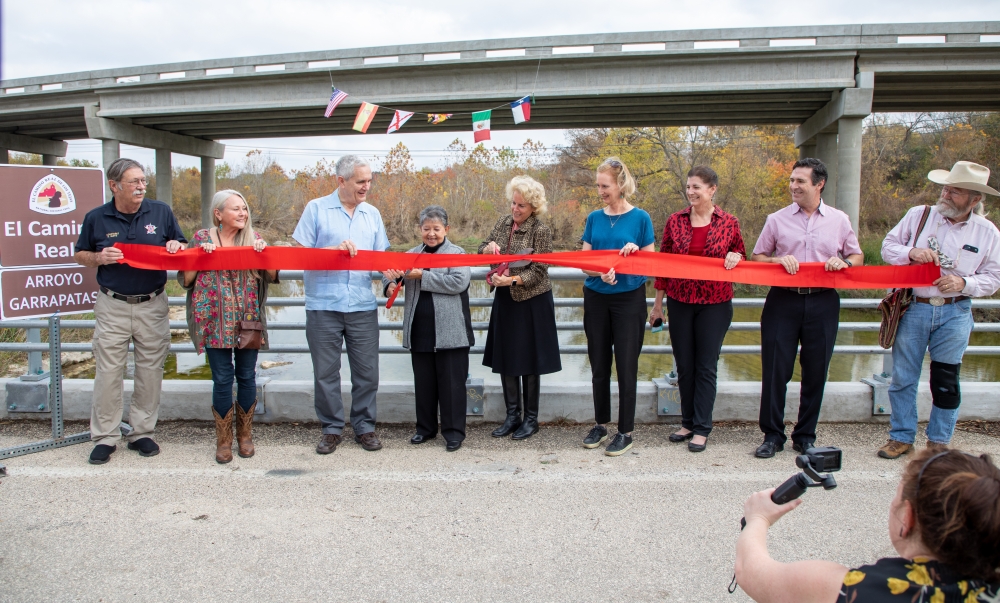 Elected officials cut a ribbon at a ceremony to dedicate the new Onion Creek Bridge. (Courtesy Travis County)