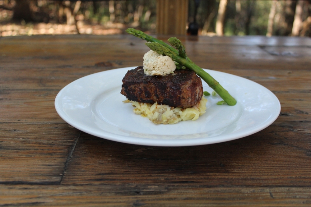 The 8oz filet mignon with cabernet demi, garlic mashed potatoes and asparagus which is currently the seasonal vegetable (market price). (Eric Weilbacher/Community Impact Newspaper)