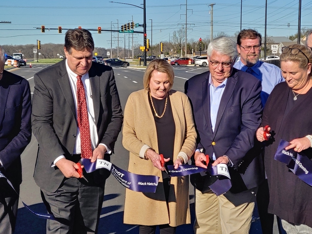 From left, TDOT chief engineer and deputy commissioner Paul Degges, Nancy Sargent, Williamson County Mayor Rogers Anderson and Franklin Vice Mayor Brandy Blanton cut the ribbon at a ceremony dedicating the Mack C. Hatcher Memorial Parkway northwest extension. (Martin Cassidy/Community Impact Newspaper)