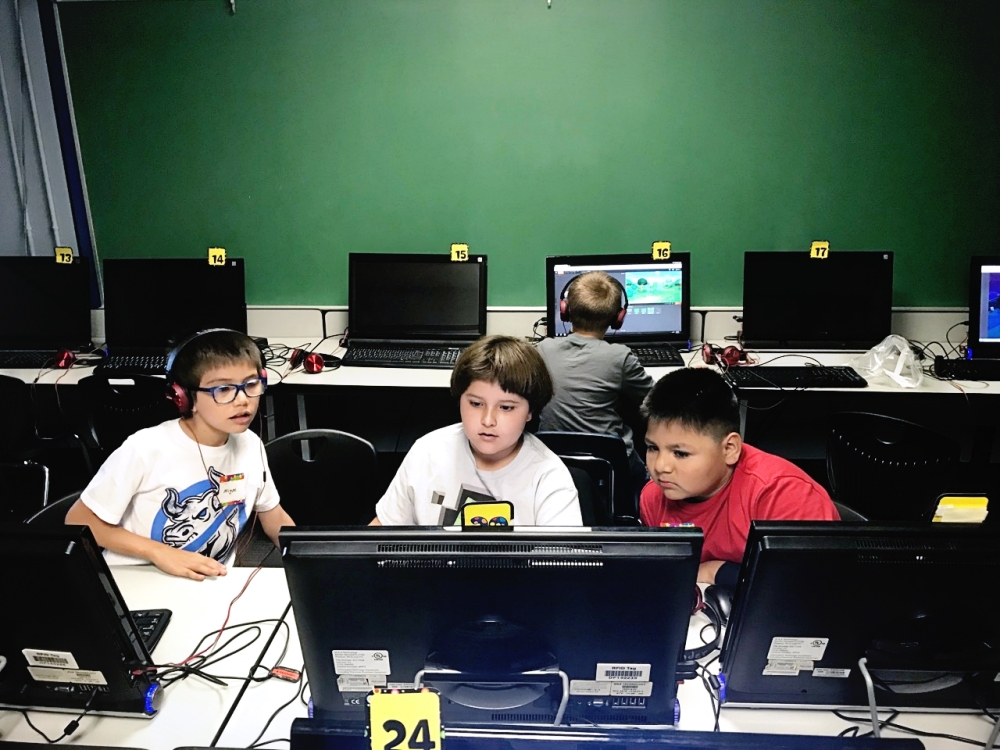 Kids study coding during after school lessons. (Courtesy Austin Kids Can)